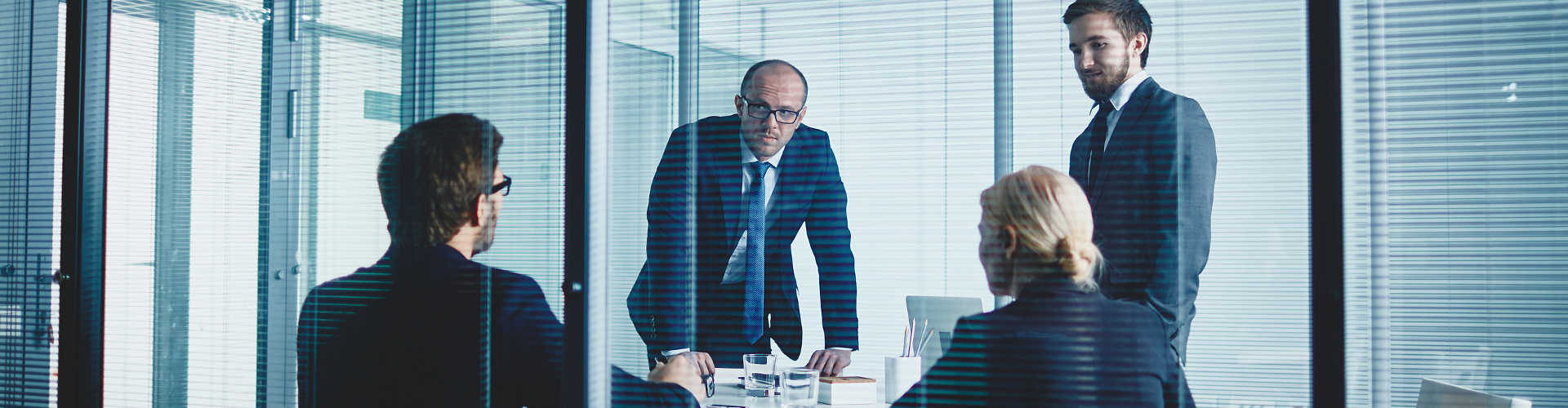 Business team having meeting by workplace